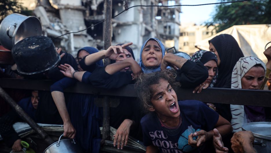 Palestinians gather at a food distribution point in Gaza City, on July 20, 2025. The World Food Programme says nearly one in three people in Gaza do not eat for days at a stretch, and ''thousands'' are ''on the verge of catastrophic hunger''. (Photo by Majdi Fathi/NurPhoto via Getty Images)