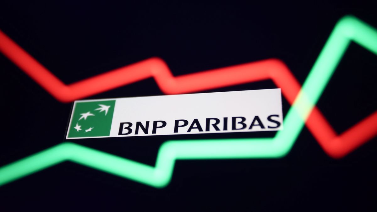 An illustrative stock chart and BNP Paribas logo displayed on a phone screen are seen in this multiple exposure illustration photo taken in Krakow, Poland March 20, 2023. (Photo by Jakub Porzycki/NurPhoto via Getty Images)