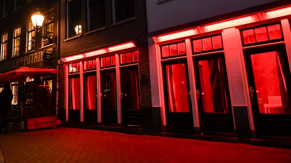 AMSTERDAM, NETHERLANDS - DECEMBER 10: General view of Red Light District on December 10, 2022 in Amsterdam, Netherlands.De Wallen, Amsterdam's red-light district, is internationally known and one of the main tourist attractions of the city. It offers legal prostitution and a number of coffee shops that sell marijuana. (Photo by Stefano Guidi/Getty Images)