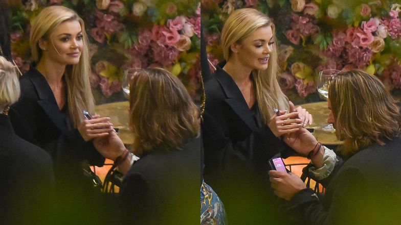 Piotr Stramowski i Edyta Folwarska wymieniają czułości na imprezie