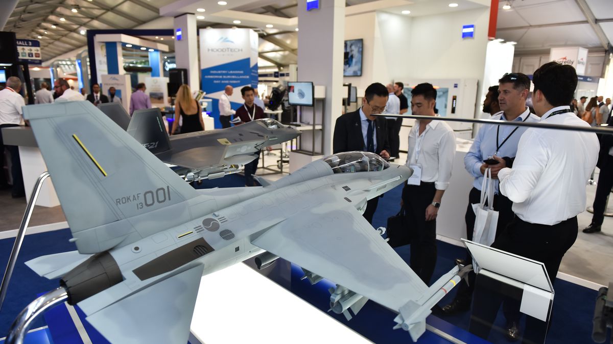 FARNBOROUGH, ENGLAND - JULY 18: Visitors view a FA-50 Multi-Role Aircraft model by KAI, Korea Aerospace Industries, LTD  during the Farnborough International Airshow 2022 on July 18, 2022 in Farnborough, England. Farnborough International Airshow 2022 will host leading innovators from the aerospace, aviation and defence industries. (Photo by John Keeble/Getty Images)