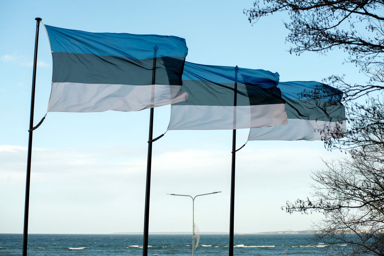 Estonia flags on the shoreline of the Baltic Sea view in Tallinn, Estonia, on Thursday, Feb. 1, 2024. The West's faltering efforts to aid Kyiv and Russia's inexorable shift to a war economy while maintaining public support are creating the sense that a new threat is emerging. Photographer: Peter Kollanyi/Bloomberg via Getty Images