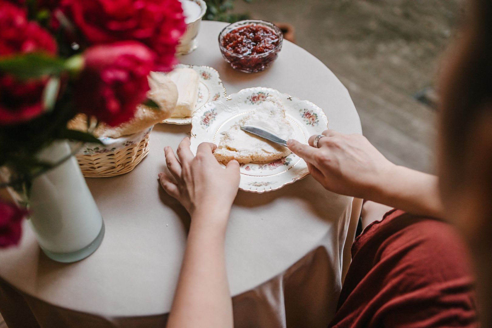 Woman spreading butter on the homemade bread