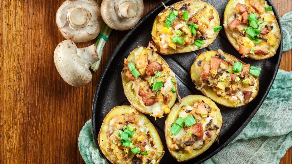 Baked potatoes in jacket stuffed with bacon, mushrooms and cheese. Dish served in baking dish. Top view
potatoes, stuffed, jacket, mushrooms, gourmet, hot, rustic, baco, view, above, top, overhead, potatoes, stuffed, jacket, mushrooms, gourmet, hot, rustic, bacon, food, baked, cheese, chives, dinner, homemade, lunch, glass, dish, meal, meat, onion, portion, roasted, skin, cheddar, herbs, spices, vegetables, whole, nobody, wooden, background, table, view, above, top, overhead