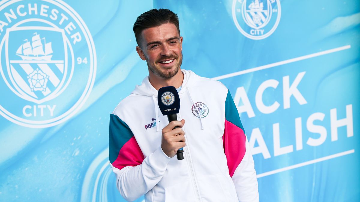 MANCHESTER, ENGLAND - AUGUST 09: Jack Grealish of Manchester City chats to the crowd during the Jack Grealish Welcome Show at Manchester City Football Academy on August 9, 2021 in Manchester, England. (Photo by Manchester City FC/Manchester City FC via Getty Images)