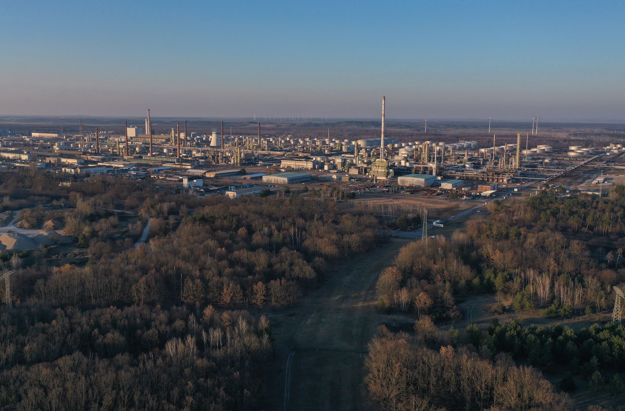 SCHWEDT, GERMANY - MARCH 21: In this aerial view the PCK oil refinery, which is majority owned by Russian energy company Rosneft, stands on March 21, 2022 in Schwedt, Germany. Russian oil arrives at the refinery via the Druzhba ("Freindship") pipeline and deliveries are so far not falling under sanctions. While the German government is seeking to penalise Russia with other sanction measures as well as weapons supplies to Ukrainian armed forces due to Russia's military invasion of Ukraine, it so far has not made any moves to restrict energy imports from Russia. (Photo by Sean Gallup/Getty Images)
