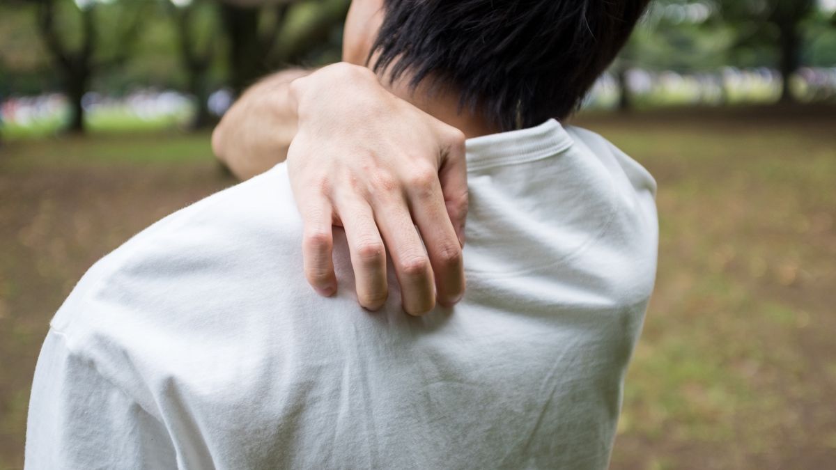 Young man holding his shoulder
Young man holding his shoulder.
AH86