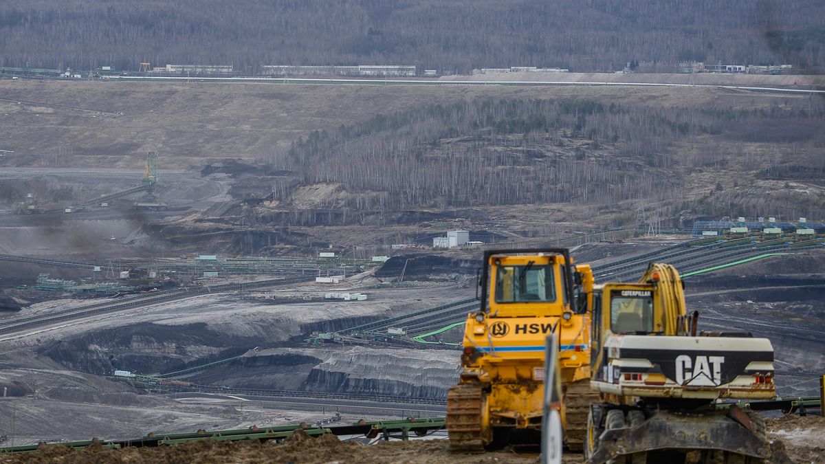 BOGATYNIA, POLAND - FEBRUARY 11: Escavators are seen inside the Turow open-pit lignite coal mine on February 11, 2020 in Bogatynia, Poland. The operating license for the Turow open pit coal mine expires in March 2020, which PGE, Poland's state-owned public power company plans to renew until 2044 through an expansion of the existing huge open-pit mine.  The Turow mine expansion is expected to increase the total surface area of the pit to 30 km2 while extending the mining operation to just 70m from the Czech border.(Photo by Omar Marques/Getty Images)