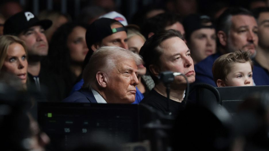MIAMI, FLORIDA - APRIL 12: U.S. President Donald Trump watch the Ultimate Fighting Championship with Elon Musk at the Kaseya Center on April 12, 2025 in Miami, Florida. The Trump administration issued a rule late Friday that spared smartphones, computers, semiconductors, and other electronics from some of the tariffs they have enacted. (Photo by Joe Raedle/Getty Images)