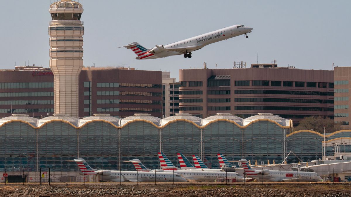 ARLINGTON, VA - MARCH 23: An American Eagle regional jet takes off over the American Airlines terminal at Washington Reagan National Airport on March 23, 2025 in Arlington, VA. (Photo by J. David Ake/Getty Images)