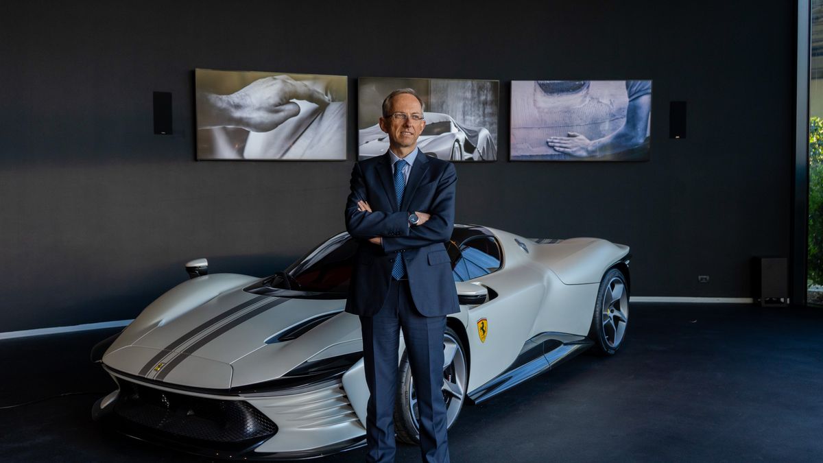 Benedetto Vigna, chief executive officer of Ferrari NV, in front of a Ferrari Daytona SP3 sports car at the company's headquarters in Maranello, Italy, on Tuesday, Feb. 7, 2023. Speaking at Ferraris Maranello headquarters, Vigna, 53, credited Tesla with accelerating change within an industry steeped in engine cylinders. Photographer: Francesca Volpi/Bloomberg via Getty Images