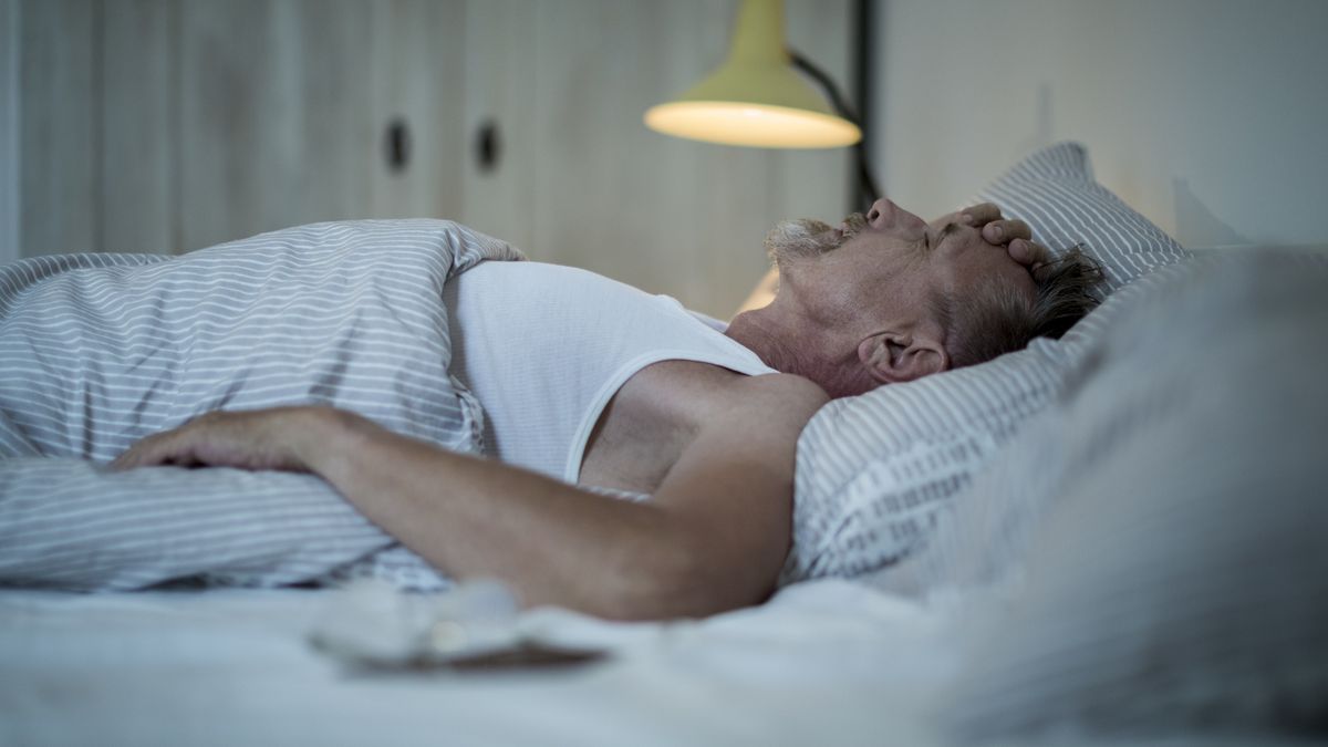Senior man in his early 60s with greying beard is sick and sleepless in bed while night.
EMS-FORSTER-PRODUCTIONS
megrim, migraine, bad dream, sickness