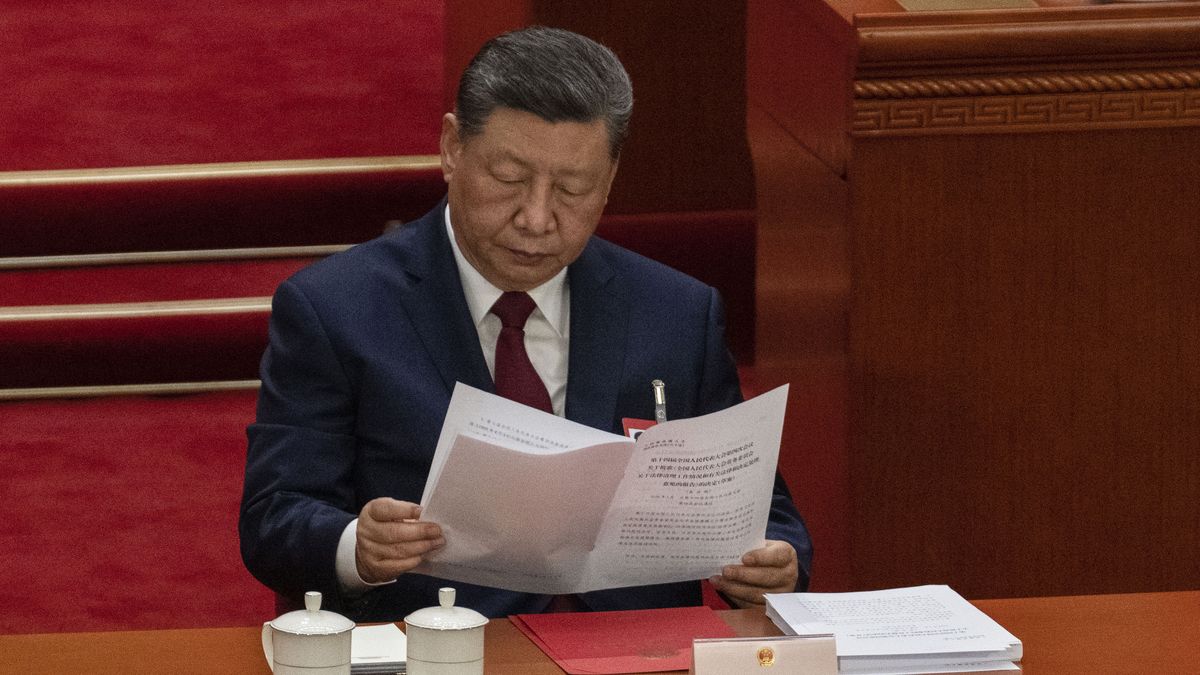 BEIJING, CHINA - MARCH 12: Chinese President Xi Jinping reads as he follows along during voting at the closing session of the National People's Congress at the Great Hall of the People on March 12, 2026 in Beijing, China. China's annual political gatherings, which includes the National People's Congress (NPC) and the Chinese People's Political Consultative Conference (CPPCC), and is known as the Two Sessions, convenes leaders and lawmakers to set the government's agenda for domestic economic and social development for the year. The gathering closed on March 12th. (Photo by Kevin Frayer/Getty Images)