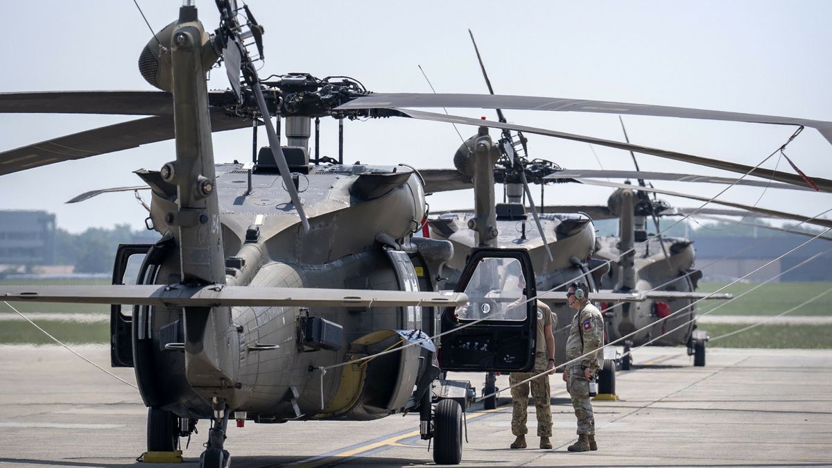 Temporary
Crew members stand near U.S. Army UH-60M Black Hawk helicopters that will participate in an upcoming military parade commemorating the Army's 250th anniversary and coinciding with President Donald Trump's 79th birthday, at Joint Base Andrews, Md., Thursday, June 12, 2025. (AP Photo/Mark Schiefelbein)
Mark Schiefelbein