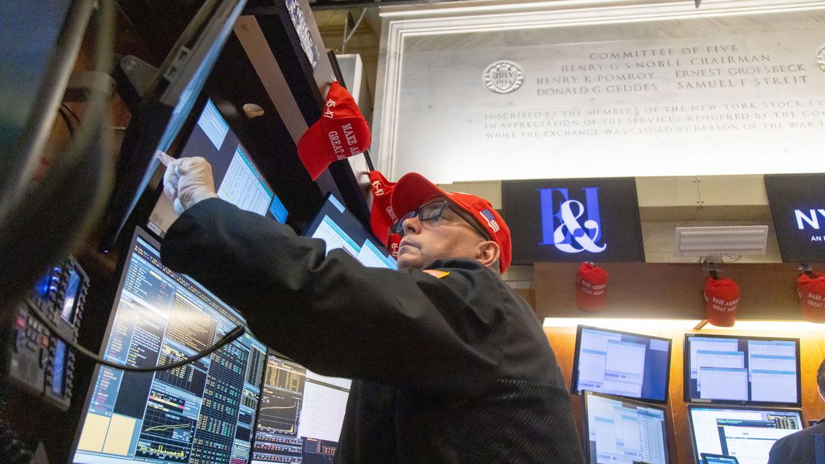 A trader wearing a Trump hat works on the floor of the New York Stock Exchange (NYSE) in New York, US, on Wednesday, Nov. 6, 2024. Donald Trump quickly put his stamp on financial markets as his victory in the US presidential election propelled "Trump Trade" plays across assets. Photographer: Michael Nagle/Bloomberg via Getty Images