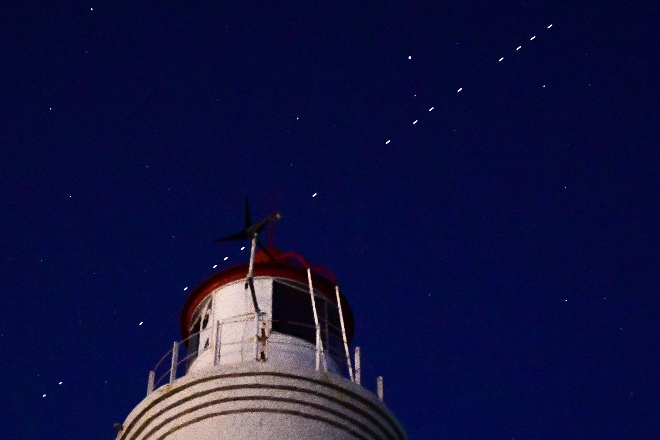 VLADIVOSTOK, RUSSIA - APRIL 27, 2020: 60 of the Starlink Internet communication satellites of Elon Musk's SpaceX private spaceflight company seen in the night sky. On April 22, 2020, SpaceX successfully launched 60 Starlink satellites into orbit on the Falcon 9 rocket from NASA's Kennedy Space Center at Cape Canaveral. The Starlink project is aimed at providing low-cost internet to remote locations; SpaceX is planning to launch into orbit about 30,000 satellites. Following the launch of the first batch of the Starlink satellites, the International Astronomical Union (IAU) and the US National Radio Astronomy Observatory (NRAO) expressed concerns about the satellites being too bright and forming a 'megaconstellation' and thus causing serious problems for astronomers.  Yuri Smityuk/TASS (Photo by Yuri Smityuk\TASS via Getty Images)