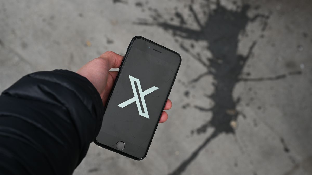 The X logo on a smartphone arranged in London, UK, on Monday, March 10, 2025. User reports indicate X, formerly Twitter, is having issues, according to Downdetector.  Photographer: Jaimi Joy/Bloomberg via Getty Images
