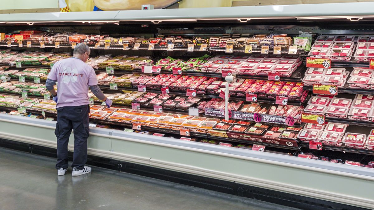 Miami Beach, Florida, Trader Joe's grocery store, refrigerated meat display case, stocking clerk. (Photo by: Jeffrey Greenberg/Universal Images Group via Getty Images)