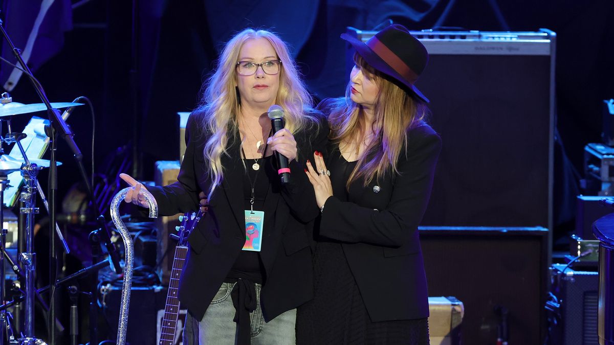 LOS ANGELES, CALIFORNIA - APRIL 26: Christina Applegate (L) speaks onstage during the Light Up The Blues 7 Concert celebrating Autism Speaks' 20th Anniversary at the Greek Theatre on April 26, 2025 in Los Angeles, California. (Photo by Kevin Winter/Getty Images)