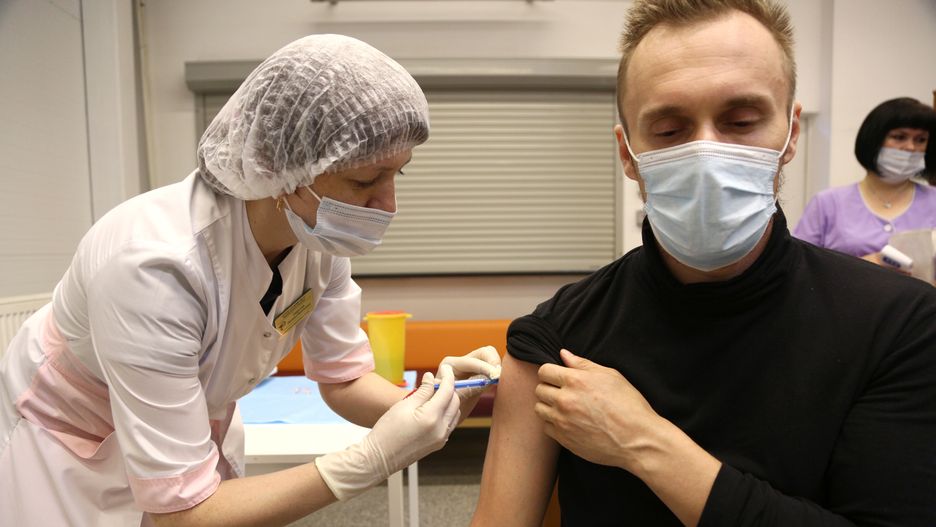 OMSK, RUSSIA - JUNE 29, 2021: A man receives a shot of the Gam-COVID-Vac (Sputnik V) vaccine at a COVID-19 vaccination site at the Mega shopping center. Yevgeny Sofiychuk/TASS (Photo by Yevgeny Sofiychuk\TASS via Getty Images)