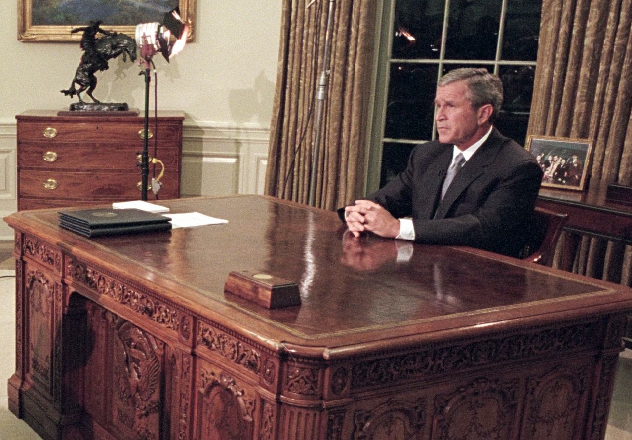 A small box with a red button on the Resolute desk