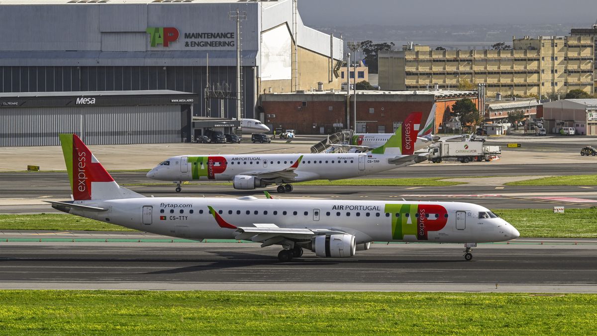 LISBON, PORTUGAL - DECEMBER 08: A TAP Air Portugal aircraft lands in Humberto Delgado International Airport as TAP Air Portugal cancels 360 flights on December 8 and 9 due to a strike called by the National Union of Aviation Flight Personnel (SNPVAC) on December 08, 2022 in Lisbon, Portugal. The Portuguese airliner TAP usually provides 300 flights a day. Strikes are expected in multiple destinations around Europe as inflation has affected company recovery plans and employee wages. TAP decided to cancel flights affecting some 50 thousand passengers, after having received the strike notice from the National Union of Aviation Flight Personnel (SNPVAC) for December 8 and 9, in order to end uncertainty for customers. TAP said in a November 28 statement that "To prevent Customers with flights booked for these dates from being further affected by the uncertainty over whether or not their flight, due to the strike, will take place, TAP has decided to cancel 360 flights scheduled for the two days of the strike. This decision will be very costly for TAP, but it is the right decision to protect our passengers." (Photo by Horacio Villalobos#Corbis/Getty Images)