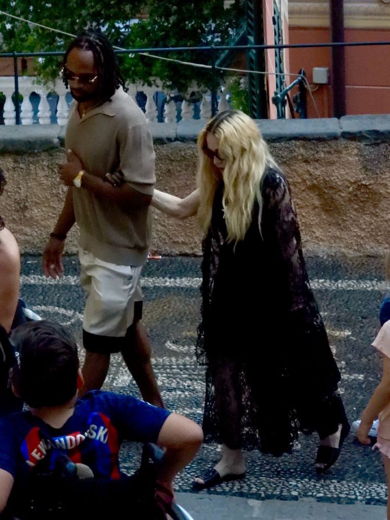 Madonna in Italy with a much younger guy