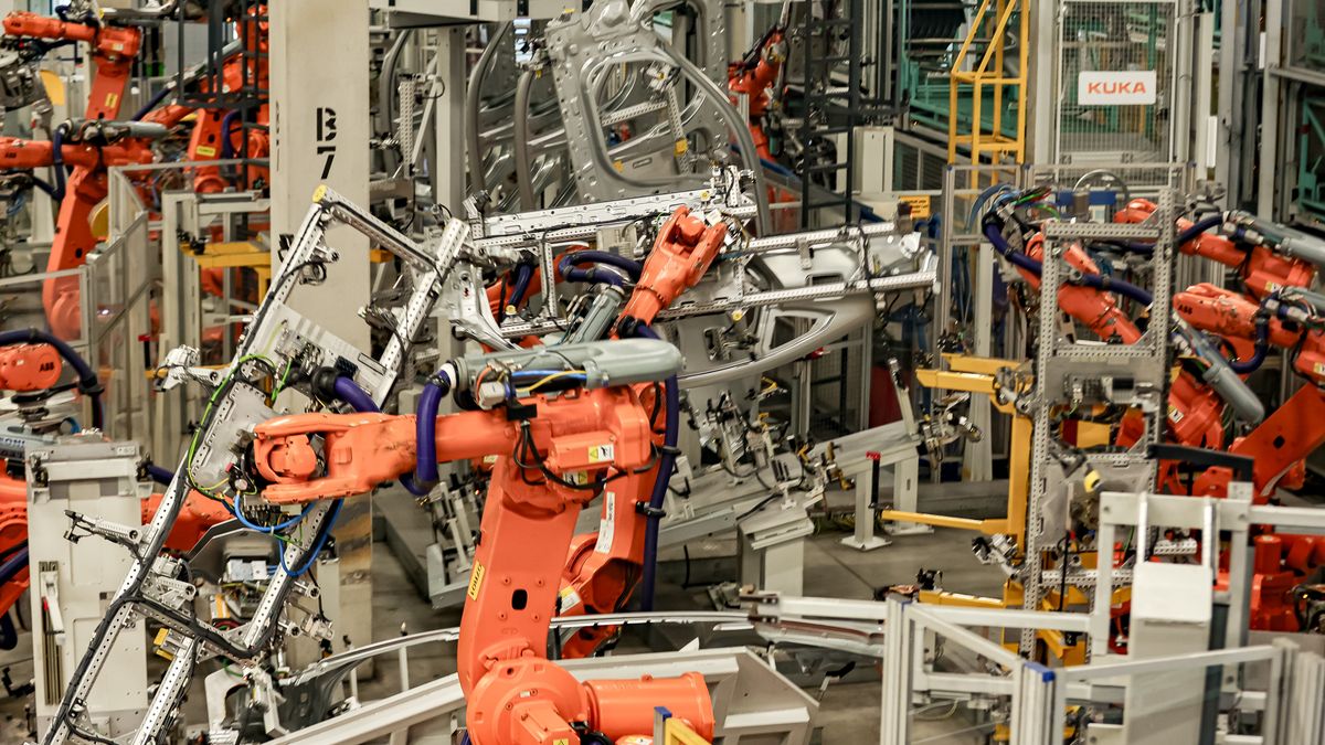 MUNICH, GERMANY - DECEMBER 05: A look at robots from the manufacturer Kuka in a production hall during the visit of German Chancellor Olaf Scholz to the BMW Group car factory on December 05, 2023 in Munich, Germany. His visit is taking place as Scholz's government wrestles with a federal budget crisis stemming from a recent Federal Constitutional Court ruling. (Photo by Leonhard Simon/Getty Images)