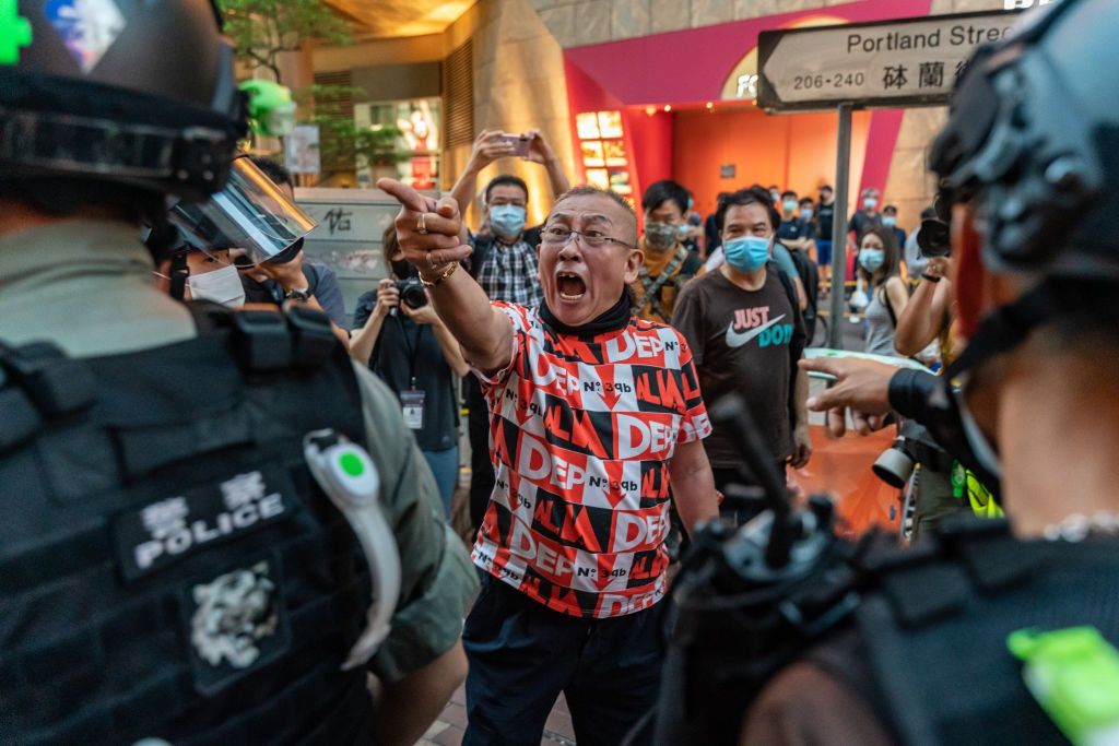 Hong Kong Marks One Year Since The Start Of Pro-Democracy ProtestsHONG KONG, CHINA - JUNE 12: A pro-democracy supporter shouts at riot police during an anti-national security law rally in Mongkok district on June 12, 2020 in Hong Kong, China. Protesters heeded online calls to gather as the city marks the one-year anniversary of the major clashes between police and pro-democracy demonstrators over the controversial extradition bill. (Photo by Anthony Kwan/Getty Images)Anthony Kwanbestof, topix