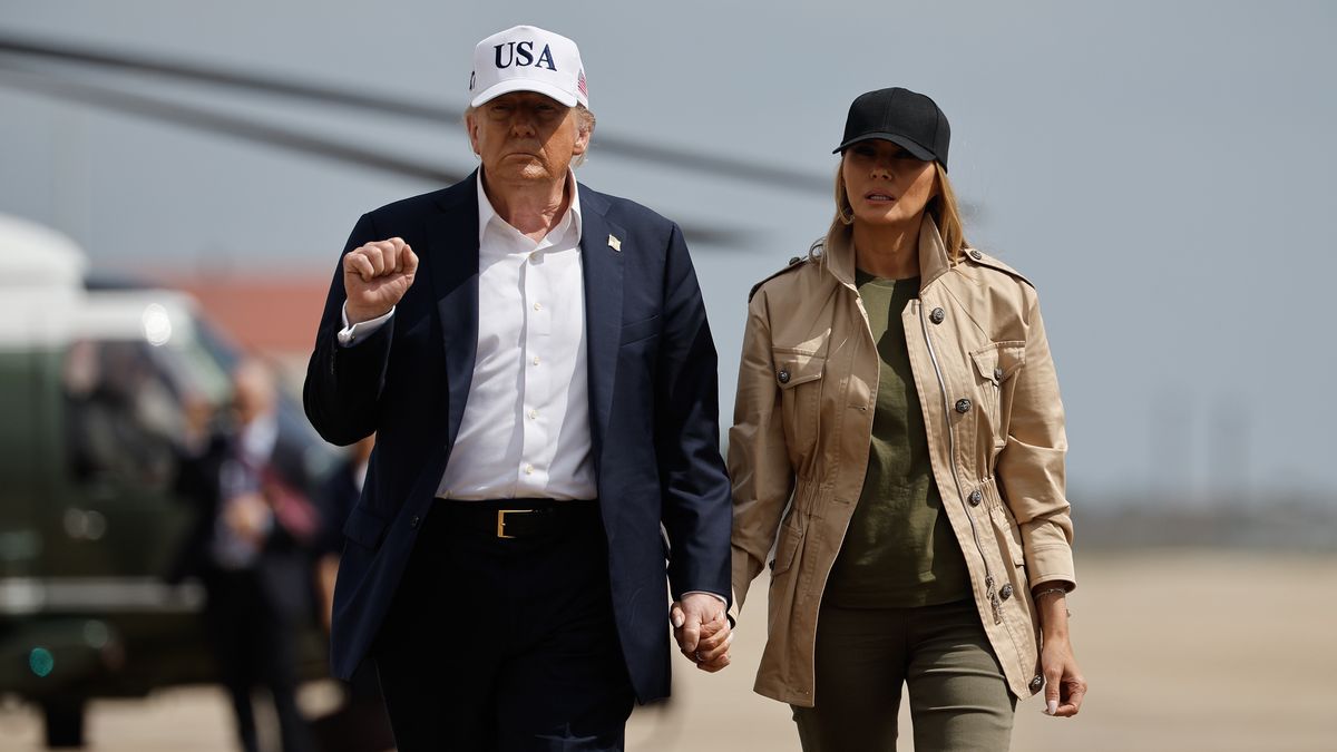 SAN ANTONIO, TEXAS - JULY 11: President Donald Trump and first lady Melania Trump visit walk across the tarmac at Lackland Air Force Base after meeting with state and local leaders, first responders and victims of last week's flash flooding on July 11, 2025 in San Antonio, Texas. Trump traveled to Texas one week after flash flooding along the Guadalupe River swept through cities, mobile home parks and summer camps, killing 120 people. Ninety-six of those killed were in Kerr County, where the toll includes at least 36 children. (Photo by Chip Somodevilla/Getty Images)