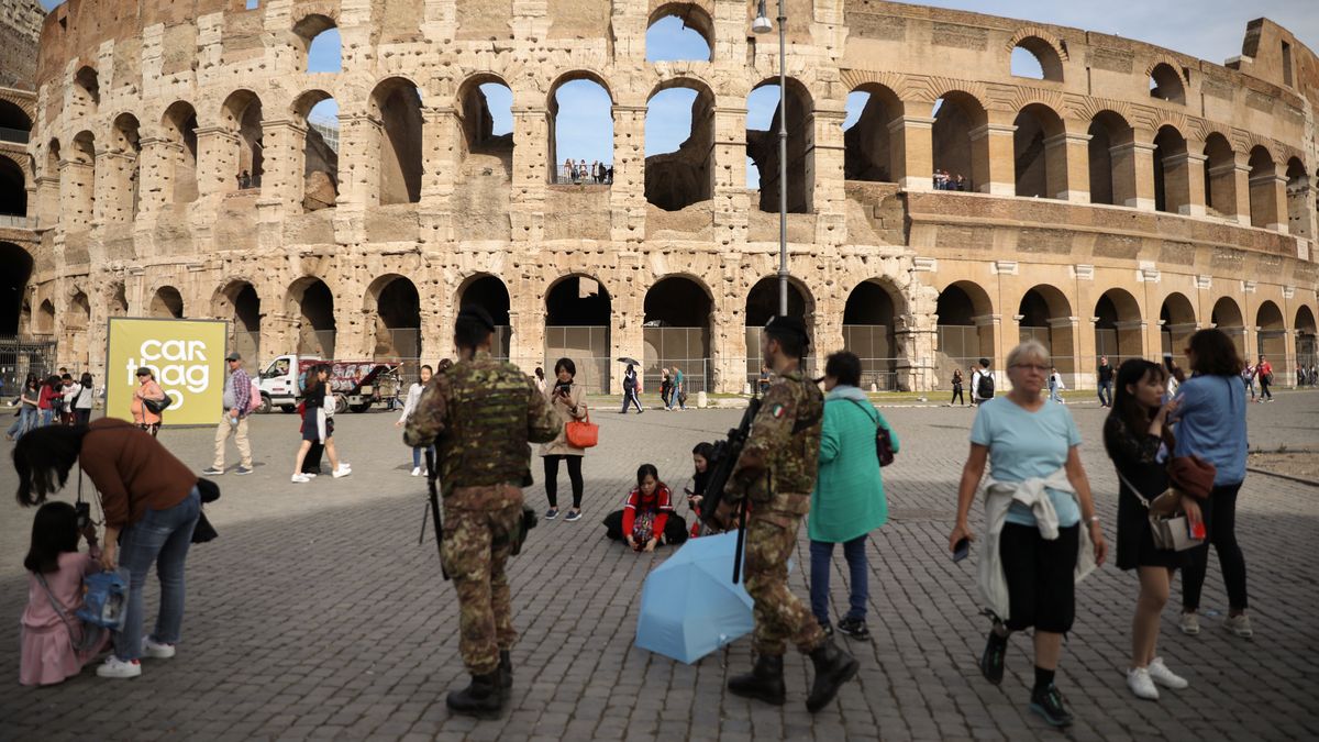 Tourists walking ahead of Coloseum in Rome, Italy (Photo by AB/NurPhoto via Getty Images)