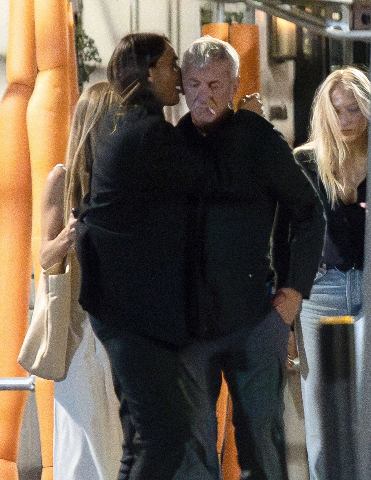 Sean Penn caught being affectionate with a younger actress.