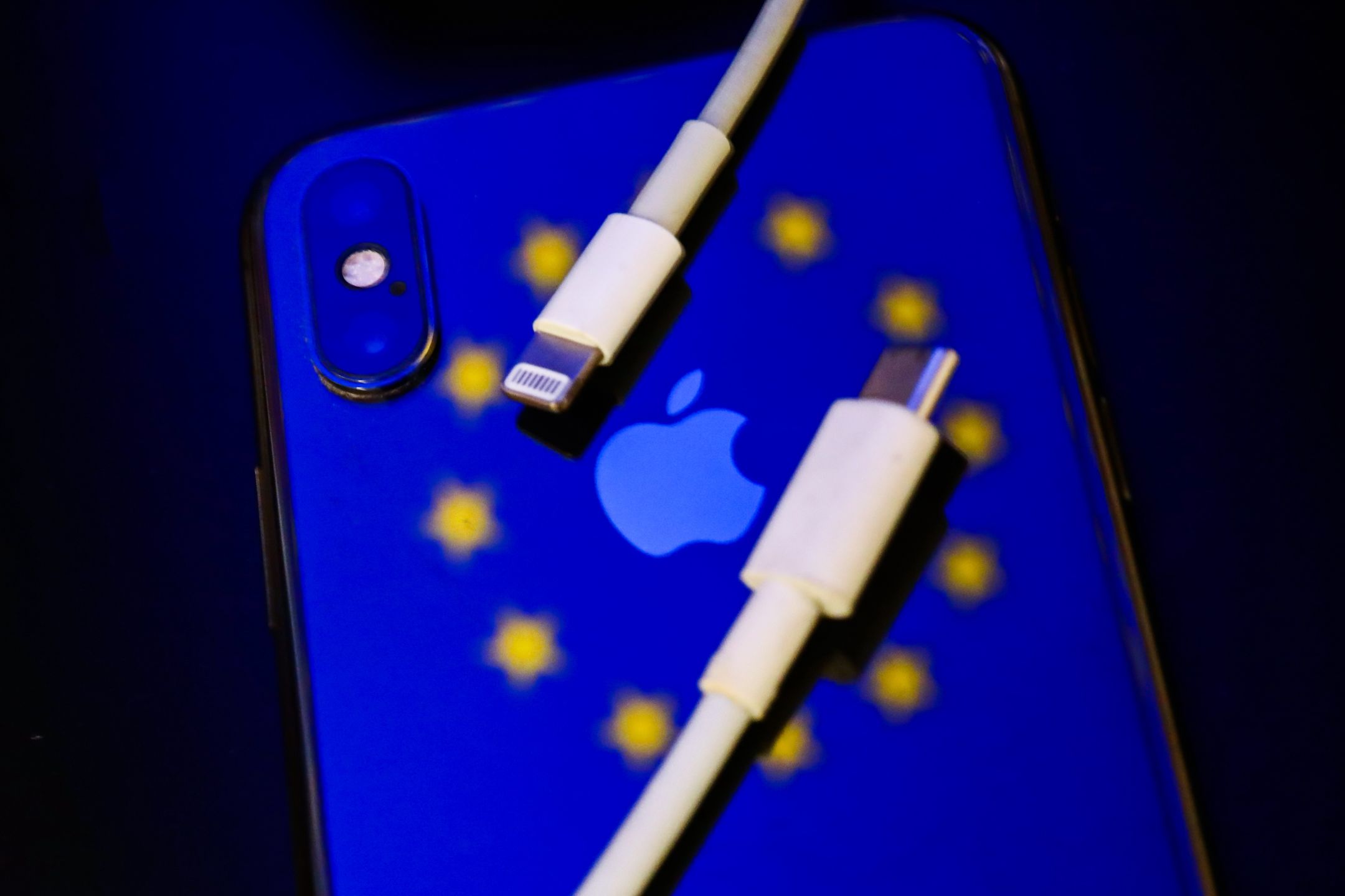 Lightning and USB-C cables are seen with European Union flag reflected on Apple iPhone in this illustration photo taken in Krakow, Poland on September 25, 2021. (Photo by Jakub Porzycki/NurPhoto via Getty Images)