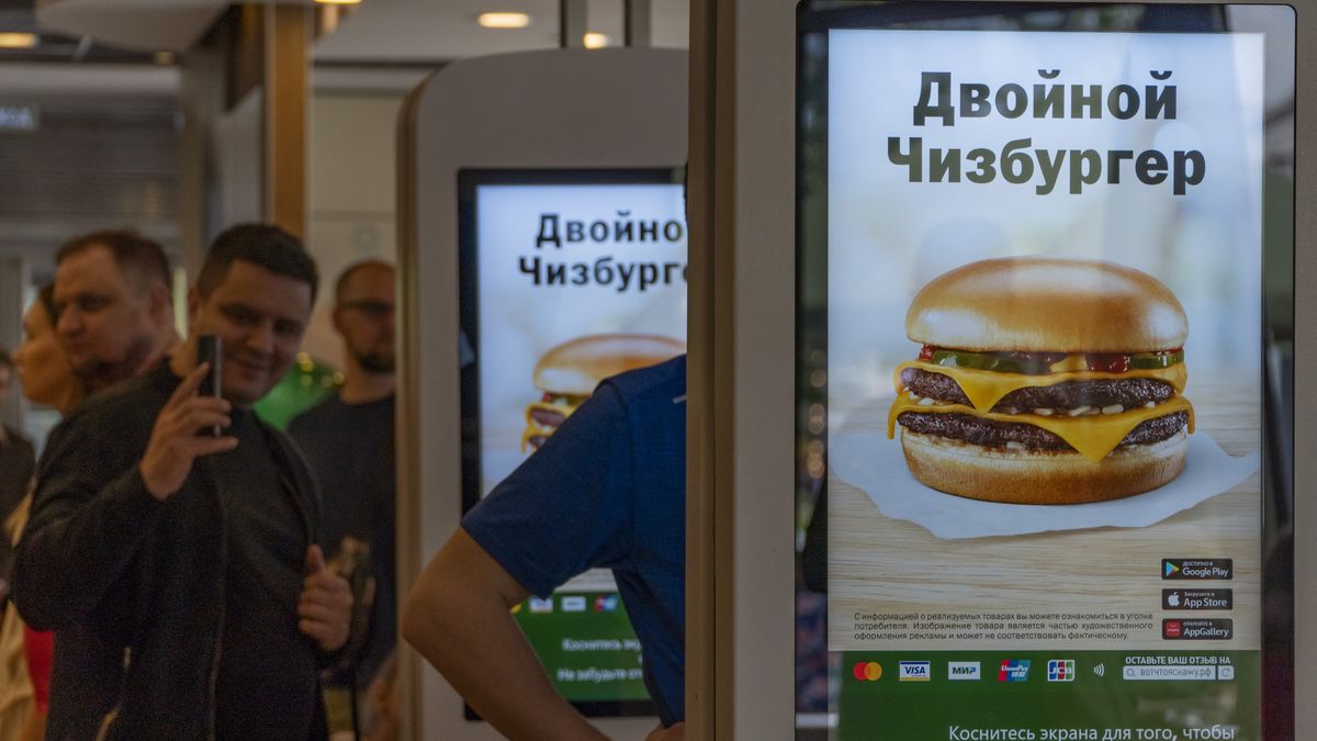 MOSCOW, RUSSIA - JUNE 12: People visit former US fast food-chain McDonald's restaurant during its reopening under a new name Vkusno i Tochka, which translates as "Tasty, period in Moscow, Russia on June 12, 2022. The burger giant had suspended operations of all its 850 restaurants in Russia over the war in Ukraine in March, and announced a full exit in May. The chain was sold to businessman Oleg Govor, a local licensee since 2015, who now plans to reopen all its restaurants by the end of summer and expand the new brand to 1,000 locations across the country within two years. (Photo by Evgenii Bugubaev/Anadolu Agency via Getty Images)