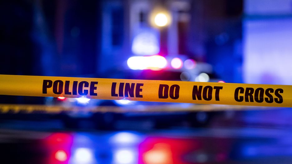 WASHINGTON, DC - MARCH 12: Caution tape hangs as members of the Metropolitan Police Department investigate a shooting between two cars at the 400 block of 11th Street SE, on Sunday, March 12, 2023. One male was pronounced dead at the scene and a second male succumbed to their injuries on the way to the hospital. (Photo by Al Drago for The Washington Post via Getty Images)