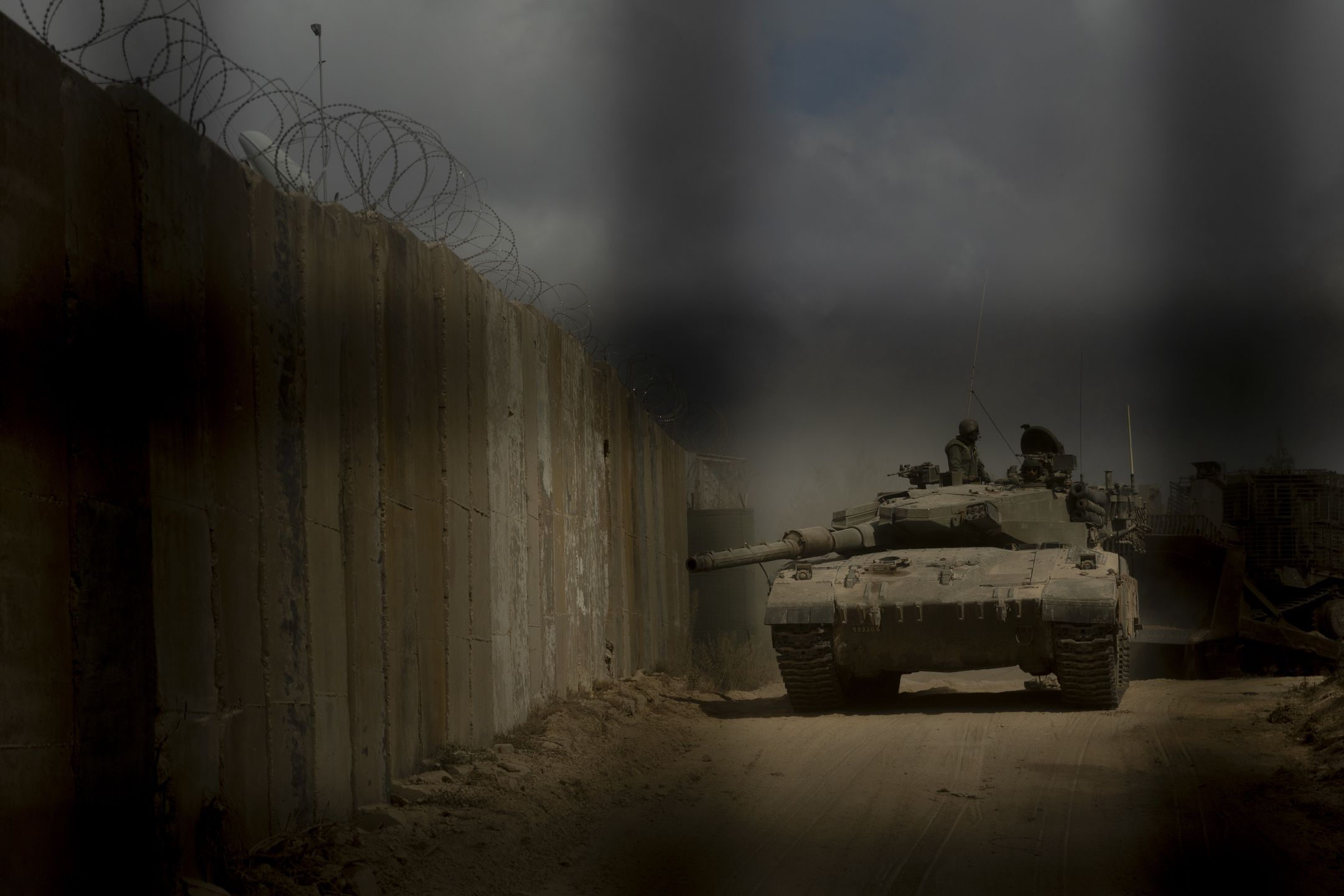 NAQOURA, LEBANON - OCTOBER 13: (EDITORS NOTE: Image has been reviewed by IDF prior to transmission) An Israeli tank moves a long the border as seen during an IDF embedded media tour to Southern Lebanon on October 13, 2024 near Naqoura, Lebanon. The Israel Defense Forces led members of the media on a tour into southern Lebanon to view what they described as Hezbollah military positions near the border with Israel. The war between Israel and Hezbollah has entered a new phase as Israel has launched a ground offensive in southern Lebanon and escalated its aerial campaign there. Meanwhile, Hezbollah has continued firing rockets into northern Israel, a regular occurrence since Oct. 7 of last year, when the Iran-backed militant group said it was attacking Israel in solidarity with Hamas in Gaza. (Photo by Amir Levy/Getty Images)
