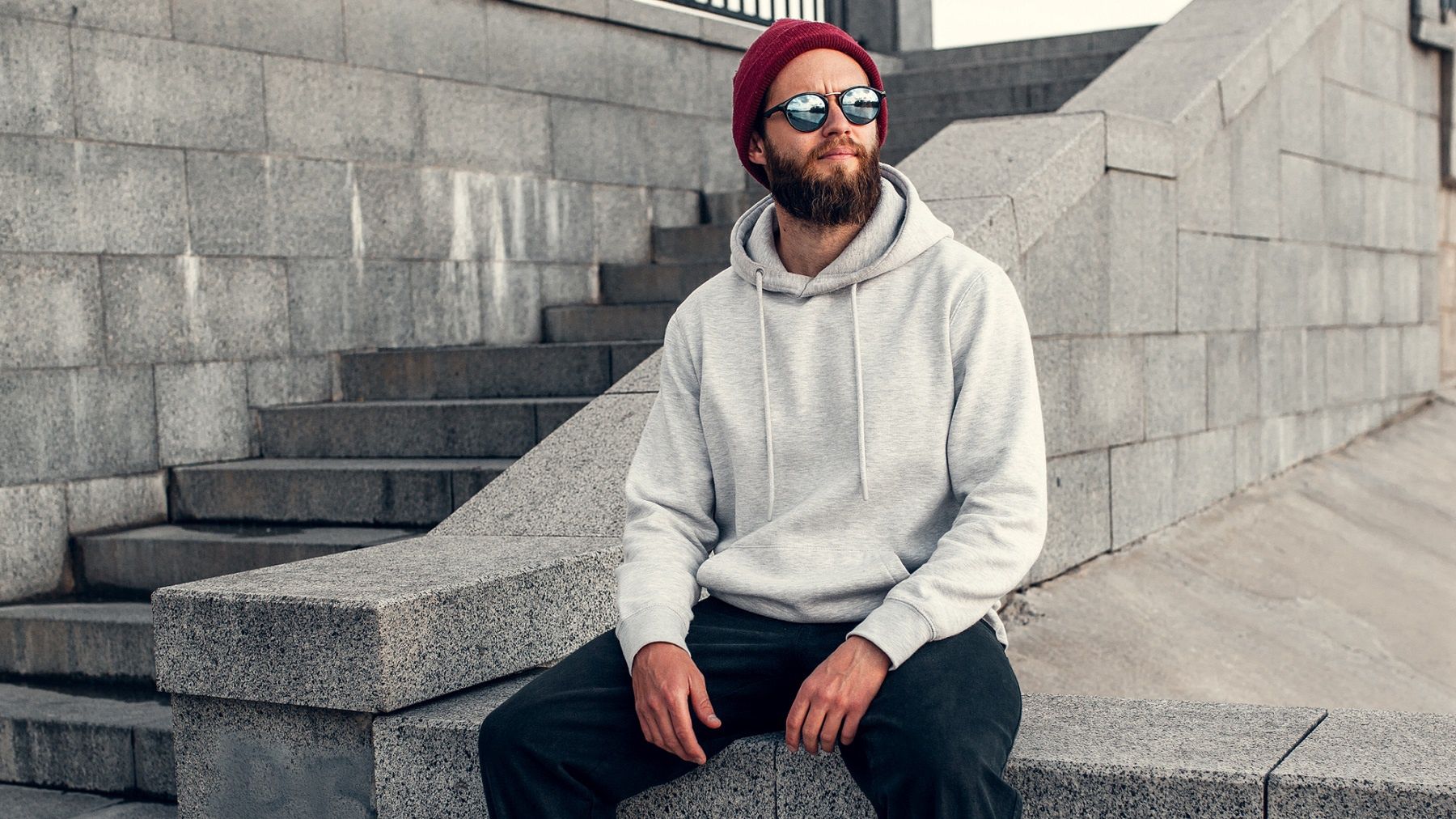 City portrait of handsome hipster guy with beard wearing gray blank hoodie or hoody with space for your logo or design. Mockup for printCity portrait of handsome hipster guy with beard wearing gray blank hoodie or hoody with space for your logo or design. Mockup for printshowcase, logotype, cotton, expressing, casual, attractive, gray, fashionable, cool, mustache, confidence, posing, stylish, outdoors, sexy, handsome, beard, fashion, trendy, model, blank, apparel, portrait, caucasian, brand, logo, urban, mock-up, white, guy, style, male, adult, template, young, shop, hipster, street, copy, sweatshirt, wearing, design, clothes, print, mockup, jumper, lifestyle, sport, front, hoodie