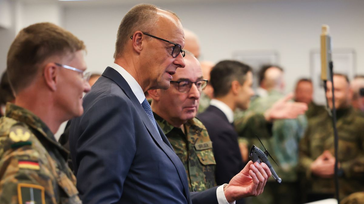 Friedrich Merz, Germany's chancellor, holds a mini drone during a visit to the 1st German-Netherlands Corps in Munster, Germany, on Thursday, Oct. 1, 2026. NATO chose German General Carsten Breuer to chair the alliance's military committee in a nod to Berlin's booming defense industry and rearmament drive. Photographer: Alex Kraus/Bloomberg via Getty Images