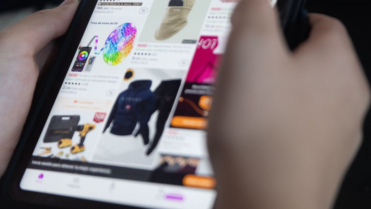 MADRID, SPAIN - DECEMBER 02: A person searches on Aliexpress on December 2, 2025, in Madrid, Spain. From 2026, the exemption from tariffs for orders of less than 150 euros from China will be eliminated, making purchases on platforms such as Shein, Temu and AliExpress more expensive. This measure seeks to curb unfair competition from the massive entry of cheap Chinese products into Europe. (Photo By Eduardo Parra/Europa Press via Getty Images)