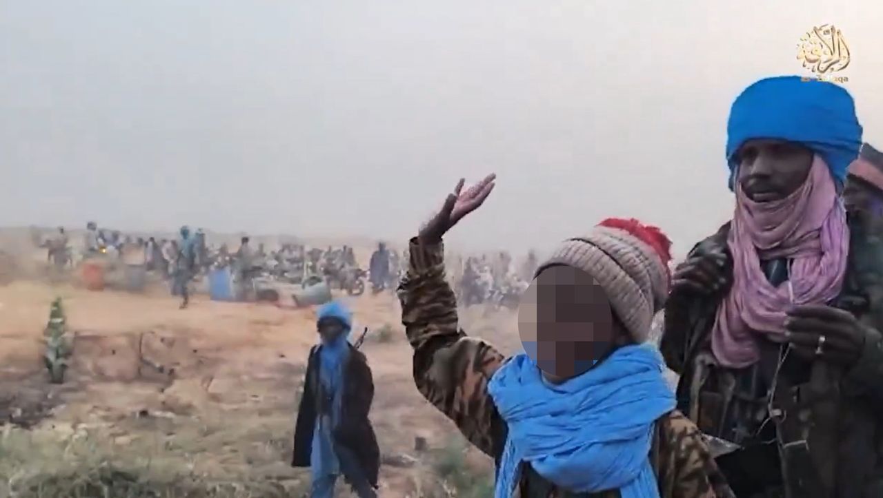 A child alongside terrorists from JNIM. The group recruits young children, even just a few years old.