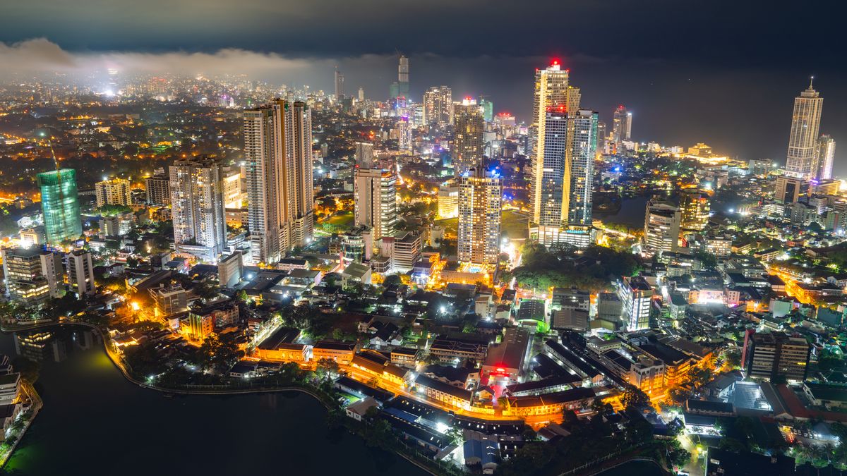 A night view of Colombo City is being seen from the top of the city on a cloudy day in Colombo, Sri Lanka, on December 12, 2023. Colombo serves as the executive and judicial capital and is the most populous city in Sri Lanka. The Colombo metropolitan area is home to 5.6 million people, with 752,993 residing within the municipality, according to the Brookings Institution. It acts as the financial hub of the island and is a popular tourist destination. (Photo by Thilina Kaluthotage/NurPhoto via Getty Images)