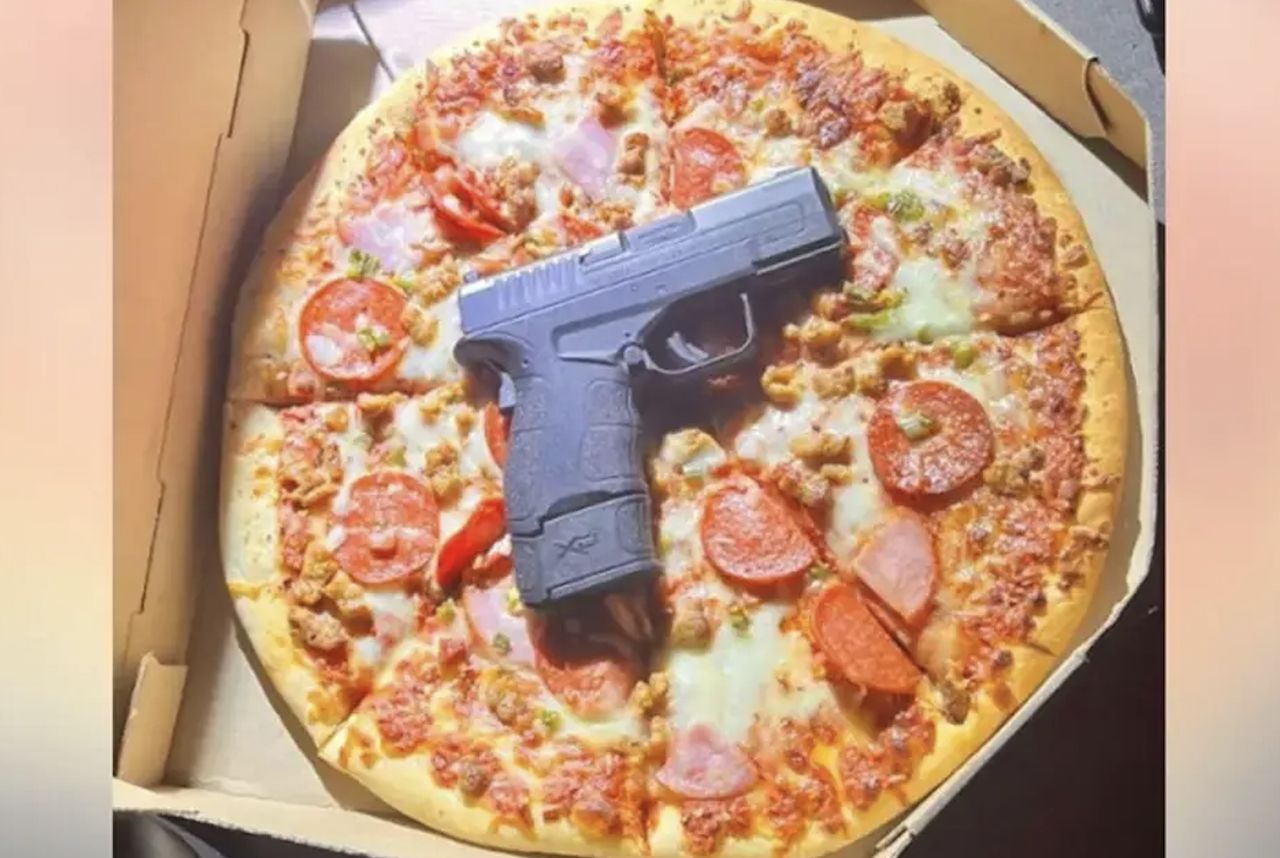 The cops were rubbing their eyes in astonishment. The gun was hidden in a pizza box.