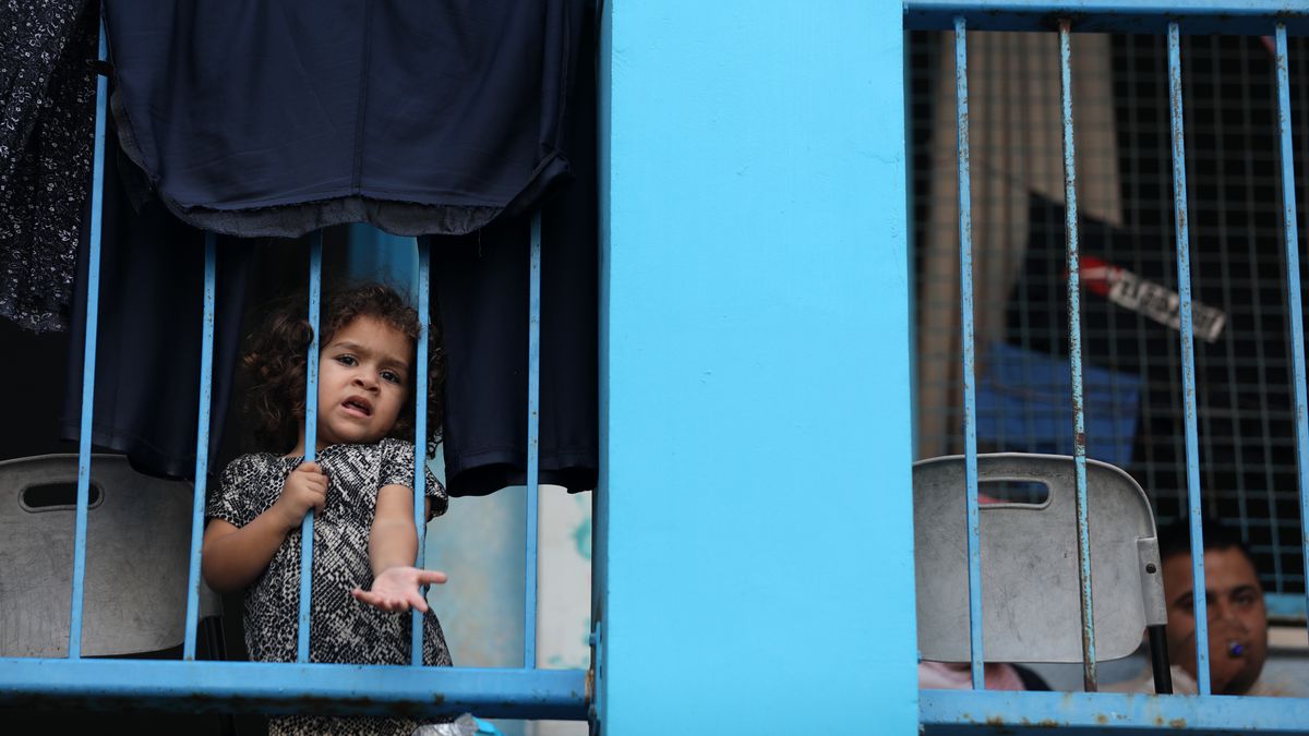 Palestinians fleeing Israeli air strikes take refuge in a school run by the United Nations in Gaza City on October 8, 2023. Fighting between Israeli forces and the Palestinian militant group Hamas raged on October 8, with hundreds killed on both sides after a surprise attack on Israel prompted Prime Minister Benjamin Netanyahu to warn that they were ''embarking on a long and difficult war.'' 
 (Photo by Majdi Fathi/NurPhoto via Getty Images)