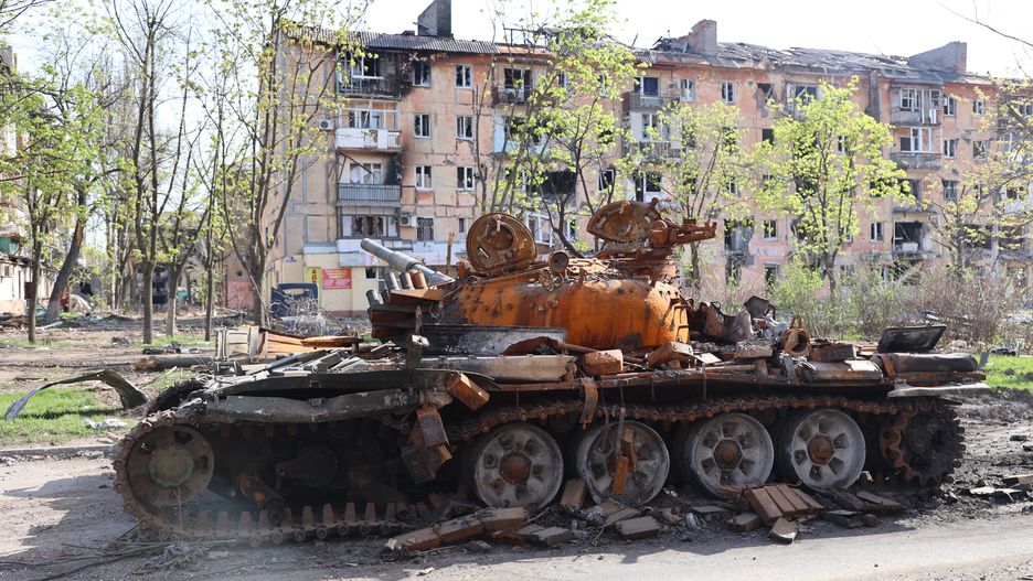 MARIUPOL, UKRAINE - APRIL 26: A burnt tank of the Donetsk army is seen in the city of Mariupol on April 26, 2022. Mariupol is progressively establishing a quiet existence today. People in locations where hostilities have just lately erupted still have nothing to eat, no water, and have only recently been able to dwell in basements. People also have to deal with the fact that many of their neighbors who died under the rubble remain nearby - no one has yet been able to collect and bury these bodies. (Photo by Leon Klein/Anadolu Agency via Getty Images)