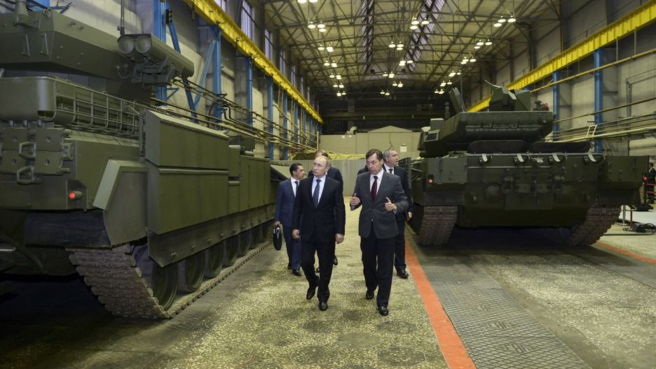 arch20
Russian President Vladimir Putin, centre left, listens to Andrei Terlikov, the head of the Ural Transport Machine Building Design Bureau, centre right, during a visit to the UralVagonZavod factory in Nizhny Tagil in the Ural mountains, Russia, on Wednesday, Nov. 25, 2015. Putin on Wednesday ordered long-range air defense missile systems to be deployed at a Russian air base in Syria following the downing of a Russian warplane by Turkey.(Alexei Nikolsky/Sputnik, Kremlin Pool Photo via AP)
POOL SPUTNIK KREMLIN