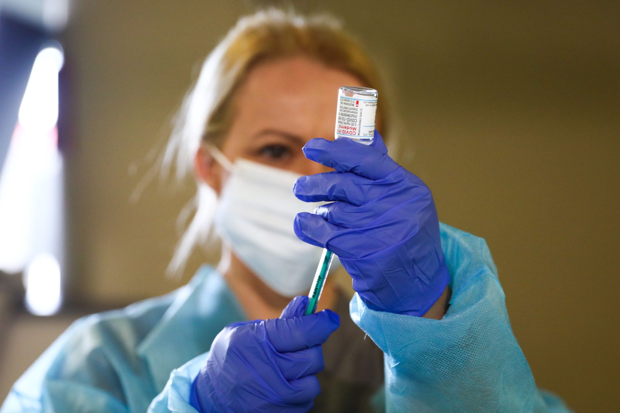 A health worker is dosing a shot of Moderna vaccine on the first day of the opening of the new Covid-19 Vaccination point at Tauron Arena Krakow. Krakow, Poland on May 7, 2021. Up to 2,000 people can be vaccinated daily with Moderna or  AstraZeneca vaccines at the 3rd massive vaccination point in Krakow and 18th in the entire Lesser Poland Voivodeship. (Photo by Beata Zawrzel/NurPhoto via Getty Images)