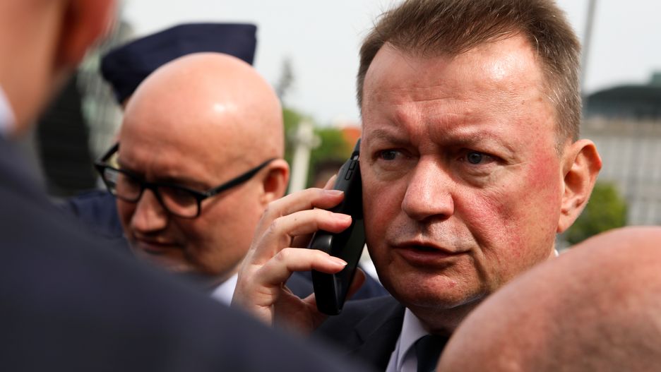 In Warsaw, Poland, on May 10, 2024, PiS MP and former Minister of National Defense, Mariusz Blaszczak, is attempting to destroy a wreath laid at the Monument to the Victims of the Smolensk Tragedy. On the anniversary of the Smolensk disaster, which resulted in the deaths of 96 people, including Polish President Lech Kaczynski and his wife, Jaroslaw Kaczynski, along with leading PiS MPs, is celebrating a ceremony at the Monument to the Victims of the Smolensk Tragedy. Every month, a group of people lays a wreath in memory of all the victims and blames President Lech Kaczynski for the plane crash. Former Prime Minister Jaroslaw Kaczynski has destroyed the wreath several times, but this time he is not succeeding. (Photo by Klaudia Radecka/NurPhoto via Getty Images)