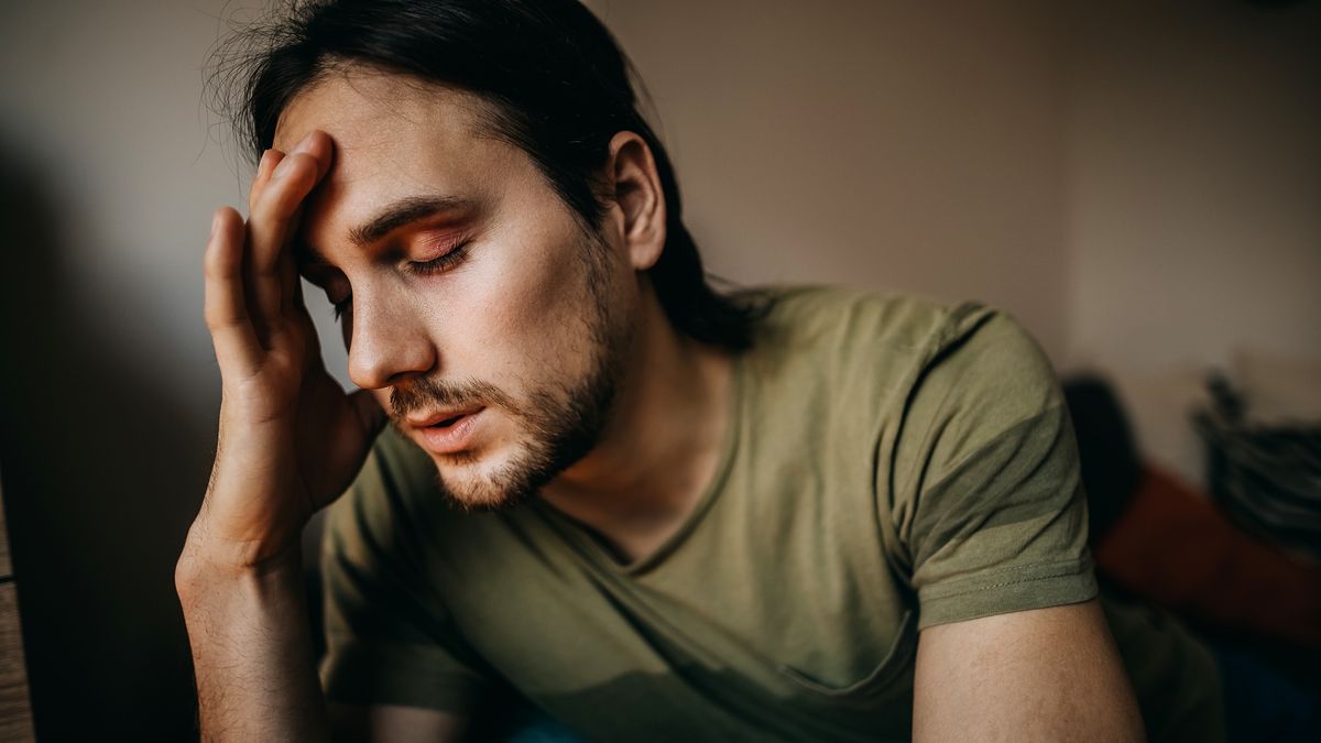 Depressed manDepressed men sitting alone in living roomStefaNikolic