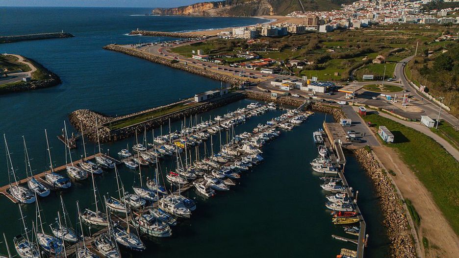 Aerial view of Port and Marina of Nazare.
Aerial view of Port and Marina of Nazare, Portugal. (Photo by: Nano Calvo/VW Pics/Universal Images Group via Getty Images)
VW Pics
coastal scenery, sailing boats, coast, fishing port, portuguese, harbor scene, atlantic coast, yachts, fishing boats, port, marina facilities, bird's-eye view, boat docks, nazare, marina attractions, beach promenade