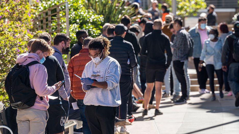 Residents wait in line outside Zuckerberg San Francisco General Hospital And Trauma Center to receive a monkeypox vaccination in San Francisco, California, US, on Tuesday, Aug. 9, 2022. Governor Newsom declared a state of emergency over the rapidly spreading monkeypox outbreak on Monday. Photographer: David Paul Morris/Bloomberg via Getty Images